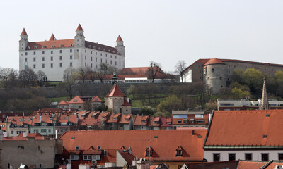 Obraz premium View of the Old Town from the Castle Hill, Bratislava, Slovakia. Street view, old red roofed houses. Spring in Europe. 
