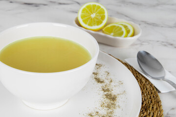 Lentil soup with lemon. Turkish soup Mercimek çorbası limon dilimleri
