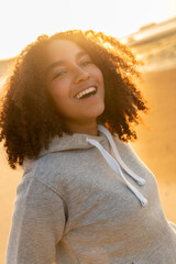 Mixed Race African American Girl Teenager Smiling on Beach at Sunset - 786408292