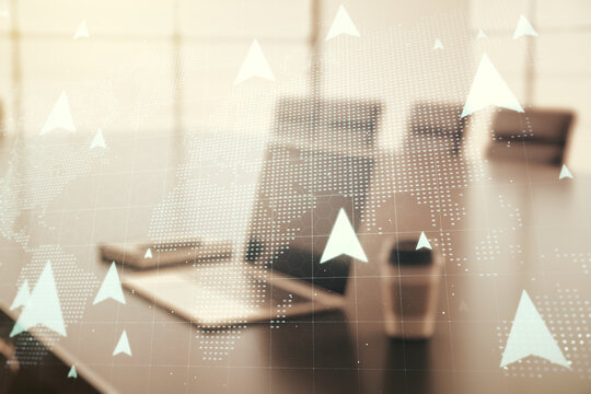 Double exposure of world map with pins hologram on laptop background. Geolocation tracking and transportation concept