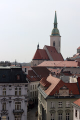 Obraz premium Old town of Bratislava, Slovakia on sunny spring day. Beautiful buildings, blossoming trees, street view. Architecture of central Europe. 