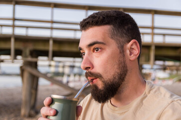 Man drinking chimarrão, mate (an infusion of yerba mate with ho - 786413812
