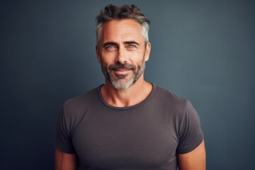 Fototapeta premium Portrait of a cheerful man in his 40s donning a trendy cropped top in front of modern minimalist interior