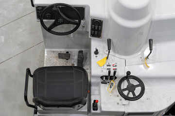 White ice rink maintenance machine photographed from above