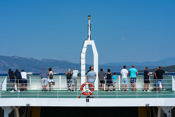 Many people on the deck of the ferry in Croatia