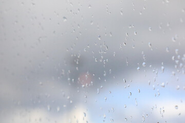 closeup shot of water droplets and rain drops on window glass