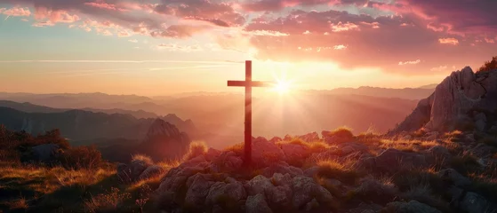 Foto op Canvas Jesus' crucifix symbolizes the love of God on a sunset sky mountain background © Zaleman