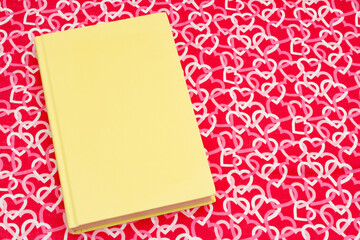 Retro old yellow book with red and white hearts - 786438624