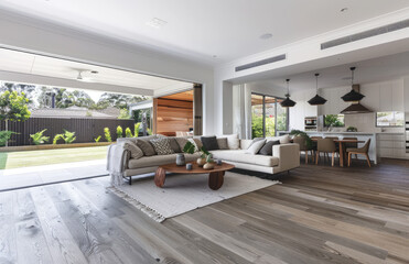 an open plan modern home interior, bright and airy in style with neutral tones, white walls, light grey floor tiles, large windows, sliding doors to the backyard - obrazy, fototapety, plakaty