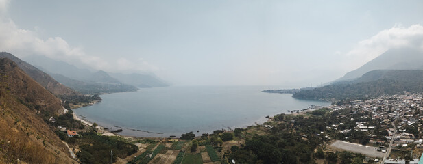 Panorama city view of San juan la laguna on lake atitlan on a smoky day