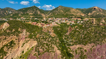 Fototapeta na wymiar Aerial view of the small village of Nebida. It is a former mining town in the municipality of Iglesias, province of Southern Sardinia, Italy.