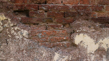 Old Brick Wall Texture Background with Peeling White Paint.