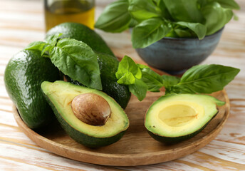 natural organic avocado with fresh basil - 786453481