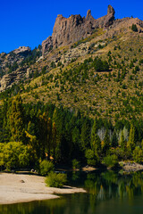 Transparent River in southern Argentina, Bariloche and San Martin de los Andes, Patagonia Route 40. Poplars in autumn changing color to yellow-green