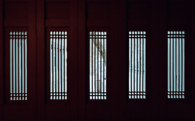 A spectacular pattern of illumination from the grid windows on Chinese foldable sheet doors of Jigu Library in Benyuan Lin's family manse at Banqiao, New Taipei City, Taiwan.