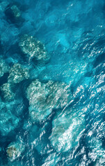 Fototapeta na wymiar Aerial View of Crystal Clear Sea Waters Along Rugged Cliffs