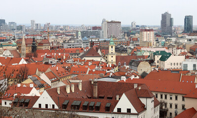 Obraz premium View of the Old Town from the Castle Hill, Bratislava, Slovakia. Street view, old red roofed houses. Spring in Europe. 
