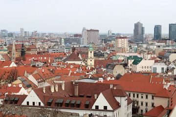 Fototapeta na wymiar View of Bratislava from the Old Town. Red roofed houses from above. Spring in Europe. 
