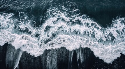 Aerial Photography of Waves crashing on a black sand beach in Iceland - Powered by Adobe