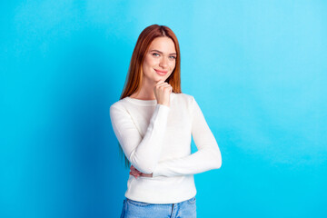 Photo portrait of attractive young woman touch chin thoughtful dressed stylish white clothes isolated on blue color background
