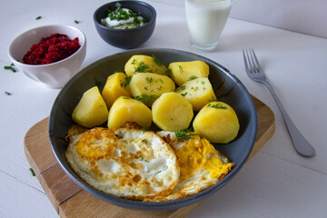 Potatoes with fried egg, buttermilk, beetroot and cucumber salad. Spring dinner - 786470897