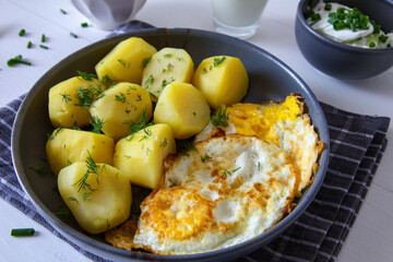 Potatoes with fried egg, buttermilk, beetroot and cucumber salad. Spring dinner