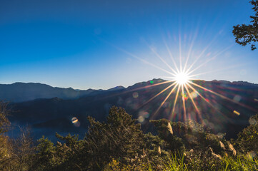 Breathtaking sunrise vista from Alishan Mountain, Taiwan. The Alishan National Scenic Area is a...