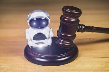 Judge Hammer for adjudication to the Real Robot. Adjudgement Gavel. Lawyer decision about Digital  assistant. Law and justice. Court of law. Pronouncing sentence to the AI Artificial Intelligence.