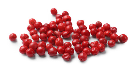 Aromatic spice. Many red peppercorns isolated on white