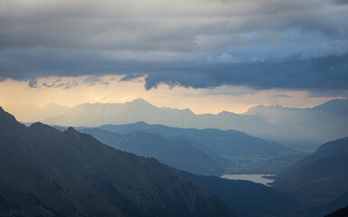 Mystic mood with mountain layers and rays of sun. Hohe Tauern mountain range in the austrian alps.