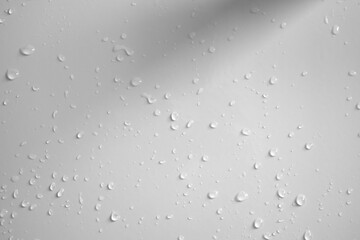 Water drops on white wall background texture