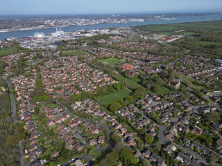 Marchwood village. High altitude aerial view of the streets and residential houses towards Marchwood Power Station and Southampton, UK.