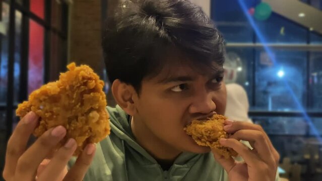 people showcasing a crispy chicken close up 4k footage