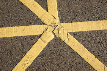 Close up of yellow road markings in car park, Edinburgh, Scotland