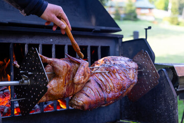 Roasting pork and turkey on spit - 786499821
