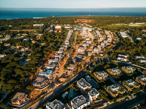 Aerial View of new luxury homes at Quinta Da Marinha Residential Area in Cascais, Portugal During Golden Hour