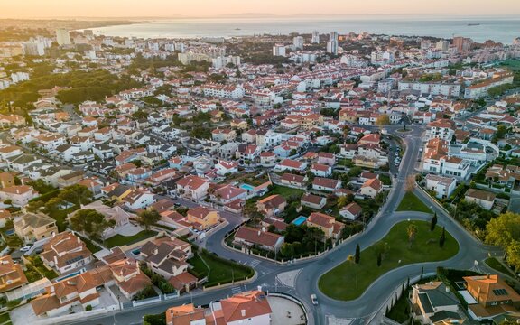 Aerial View of Cascais, Portugal at Sunset Showcasing Residential Streets and Coastal Landscape