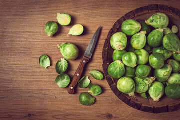 fresh Brussels sprouts, raw, top view, on a wooden table, no people,