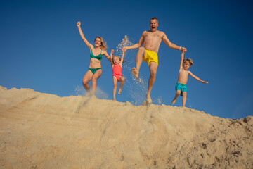 Excited family's sand dune adventure in Portugal ocean coast