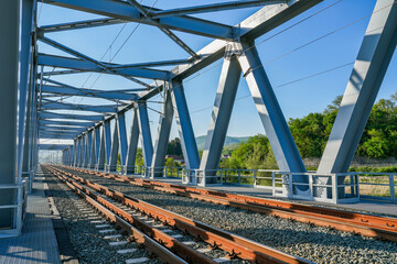 Metal structure of a railway bridge over Mures river in Arad county, Romania, Europe - 786515661