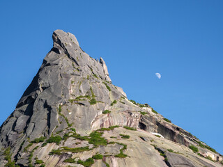 Moon over the sharp rock.