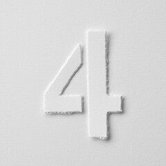 The number four is made of white paper on a white background.