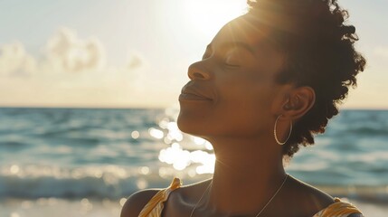 Peaceful black woman enjoying sun light at the beach - Beautiful female breathing fresh air outside - Health care and wellness concept  - obrazy, fototapety, plakaty