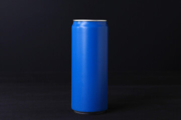 Energy drink in blue can on black wooden table