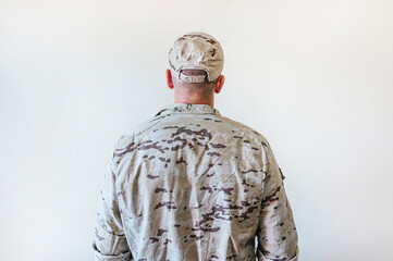 Man from back in camouflage military uniform