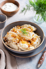 dumplings with potatoes and fried onions, Russian food
