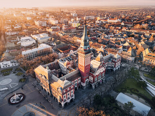 Aerial view of a famous Subotica town hall as a symbol of the city history and architectural heritage, with its red facade and elegant clock tower drawing visitors and tourists to Serbia - 786530277
