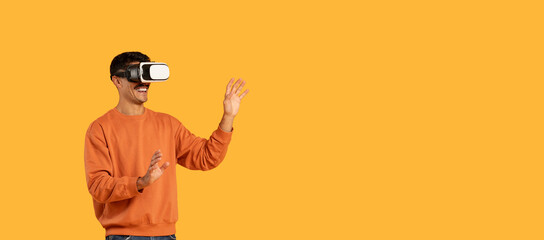 Guy engaging with virtual reality, wearing a VR headset