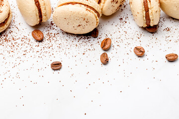 Macaroons with chocolate cream on a light background.