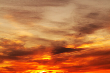 Background of a beautiful bright orange sunset with cirrus clouds - 786536471